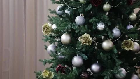 Blue and silver ball hanging on Christmas tree branch Stock Footage 227206074