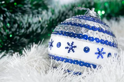 A blue and silver bubble on a white snow Stock Photos