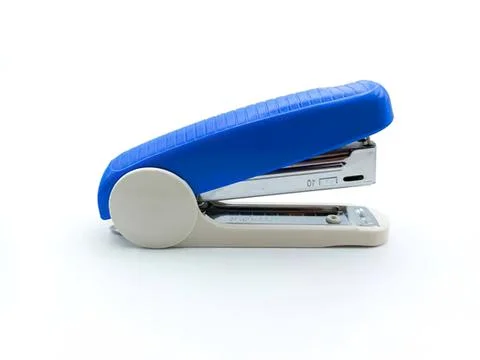 Blue and silver stapler on white background Stock Photos