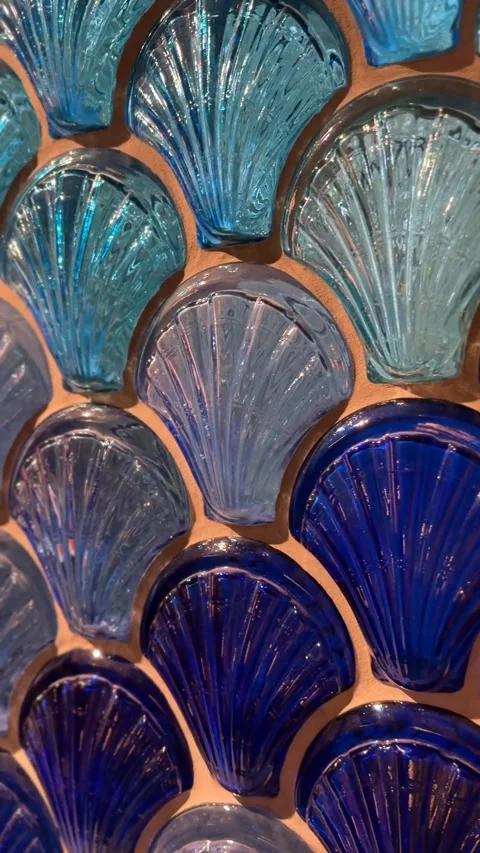 Blue and turquoise seashell-shaped glass pattern creating vibrant abstract .. 스톡 동영상 342947687