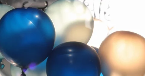 Blue and white balloon floating swivel decoration in birthday anniversary Stock Footage 87290662