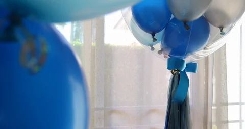 Blue and white balloon floating in living room decoration birthday anniversary Stock Footage 88322659