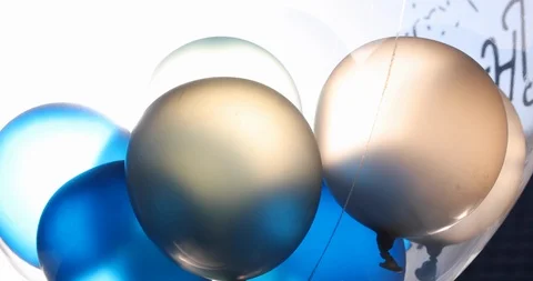 Blue and white balloon floating swivel decoration in birthday anniversary celebr Stock Footage 89198317