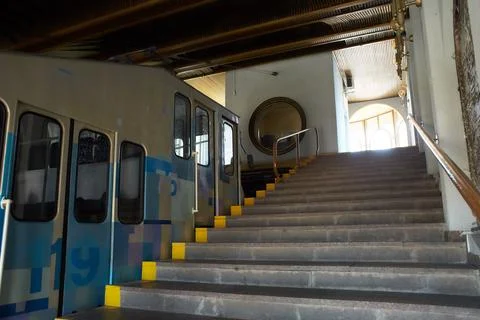 A blue and white cable funicular rises Stock Photos