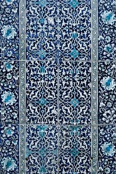 Blue and white ceramic tilework with floral arabesque pattern at Pahlavan M.. Stock Photos