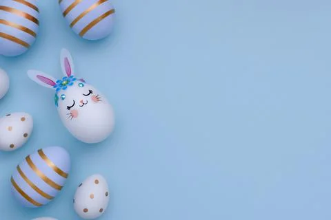 Blue and white decorated Easter eggs and Bunny Egg on blue background with copy Stock Photos