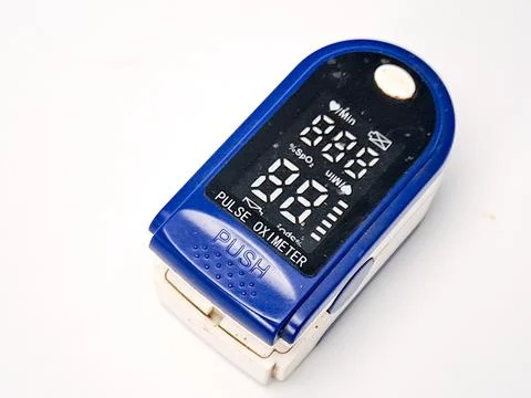 Blue and white digital pulse oximeter, used for quick health checks. Measur.. Stock Photos