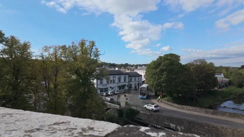 Blue and White Double Decker Bus Approaching River Maine Bridge Stock-Footage 317649266