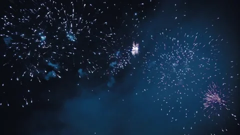 Blue and White Fireworks Exploding in the Night Sky Video stock 320337199
