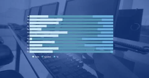 Blue and white graph processing data over computers on desks in empty office Foto stock