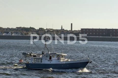 Blue and white motor yacht Emily Grace traveling upstream on Acushnet River Stock Photos
