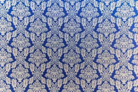 A blue and white patterned fabric with a floral design Stock Photos