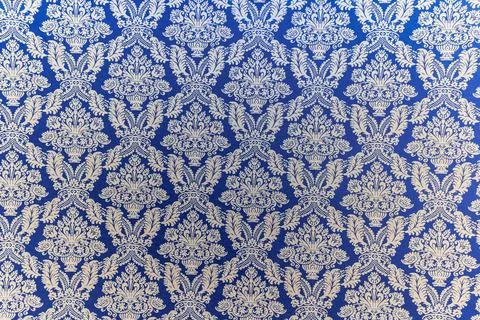 A blue and white patterned fabric with a floral design Stock Photos
