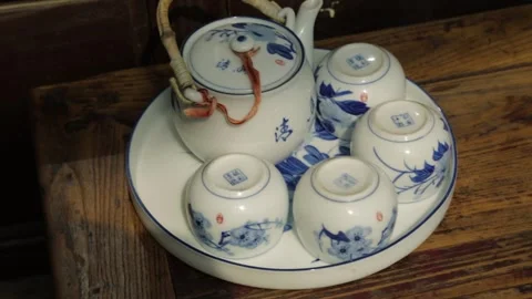 Blue and White Porcelain Tea Set on Wooden Table in Beijing Restaurant Stock Footage 345744405