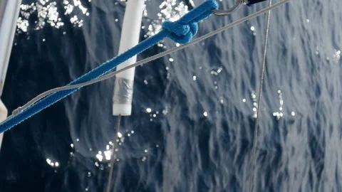 A blue and white rope is attached to a boat Stock Footage 274032344