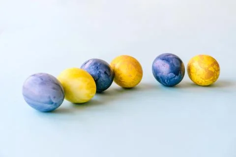 Blue and yellow Easter eggs Stock Photos