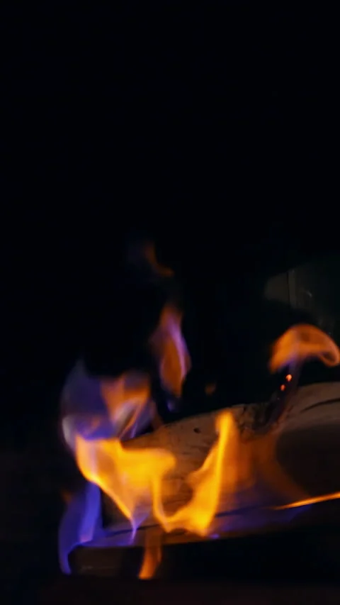 Blue and yellow fire flame burning in a stone fireplace.  Stock Footage 292011973