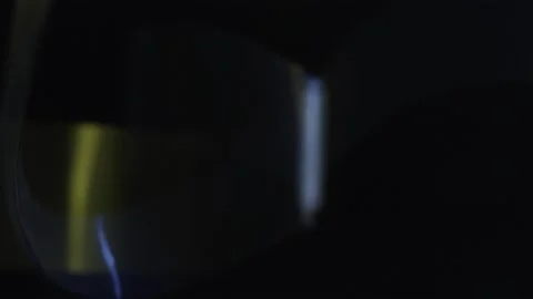 Blue and yellow flashes on a dark background Stock Footage 252377003