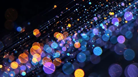 Blue and yellow flying circles resembling bokeh effect on a black background Video stock 314648997
