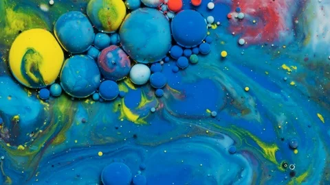 Blue and yellow inks react to form a beautiful structure of paint bubbles. Stock Footage 121222951
