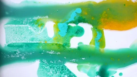 Blue and yellow paint stains. Bright ink is spreading. Video Stockbeeldmateriaal 123778173
