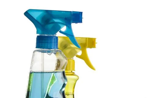 Blue and yellow trigger spray bottles blue and yellow trigger spray bottle... Stock Photos