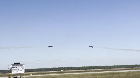 Blue Angels - 2 solos - head-on knife edge pass inverted Stock-Footage 254965545