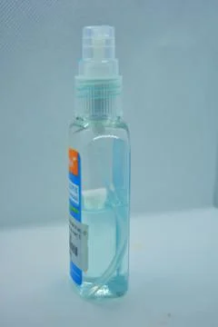 A blue antiseptic with a spray of sperm solution is located white background. Stock Illustration