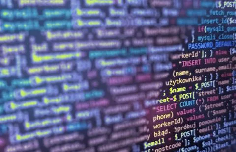 Blue application code on computer screen. PHP and HTML coding. Abstract backg Stock Photos