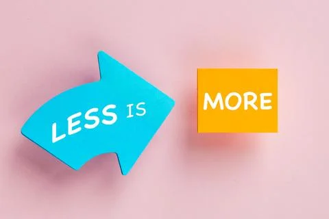 Blue arrow with text LESS IS pointing to orange block with word MORE  Foto stock