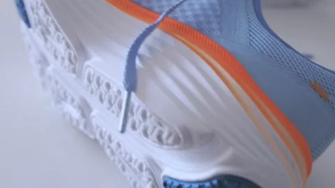 Blue athletic running shoes floating on white background Stock Footage 327678166