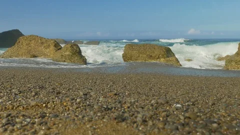 Blue Atlantic Ocean waves at the wild rocky beach Stock Footage 95547111