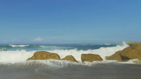 Blue Atlantic Ocean waves at the wild rocky beach Stock Footage 95547613