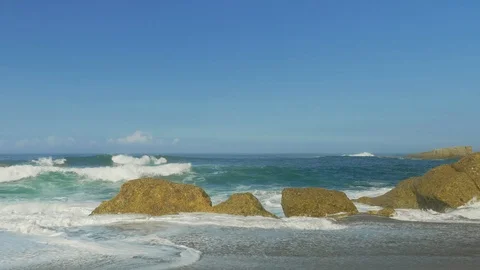 Blue Atlantic Ocean waves at the wild rocky beach Stock Footage 95548306