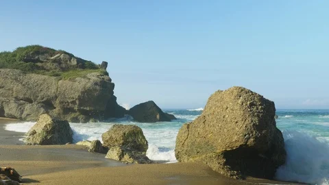 Blue Atlantic Ocean waves at the wild rocky beach Stock Footage 95559189