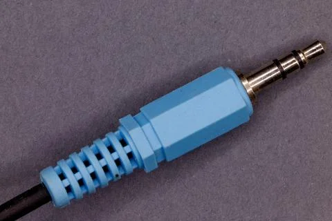 Blue audio jack cable plug connecting sound device Stock Photos