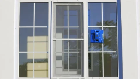 Blue automatic window washer moves down ... | Stock Video | Pond5