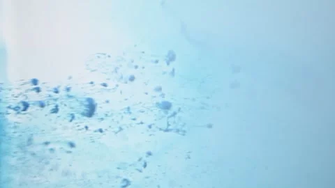 Blue background and movement of abstract particles in water. Vídeo Stock 266031022