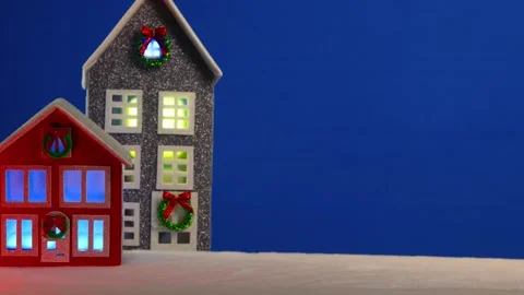 On a blue background are two Christmas houses Stock Footage 294310801