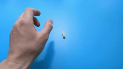 The blue background, choose between a condom and birth control pills Vídeo Stock 150421741