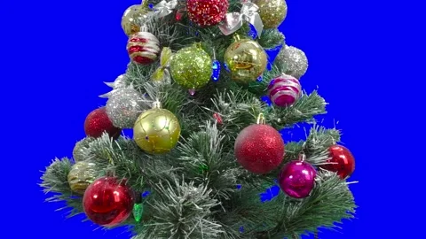 On a blue background, a Christmas tree decorated with large balls chromakey Video stock 171707295