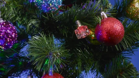 A blue background close-up balls and bells on a Christmas tree Stock Footage 166705993