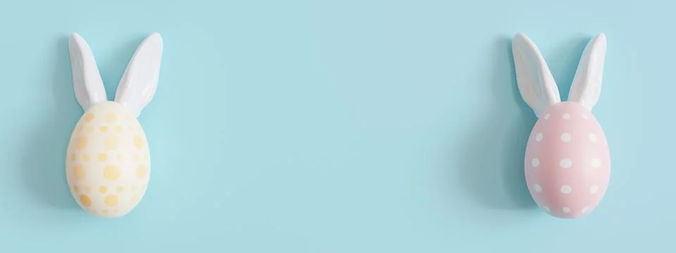 Blue background with Easter eggs, rabbit ears and copy space. Easter backdrop Stockillustratie