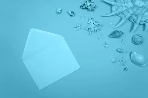 Blue background with envelope and shells and starfish Stock Photos