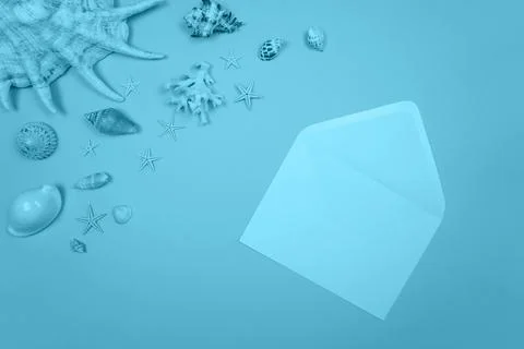 Blue background with envelope and shells and starfish Stock Photos