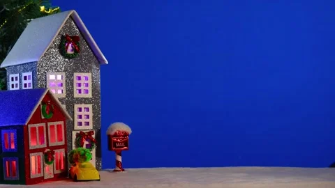 On a blue background, a gray and brown-green house with a yellow car Stock Footage 294322478