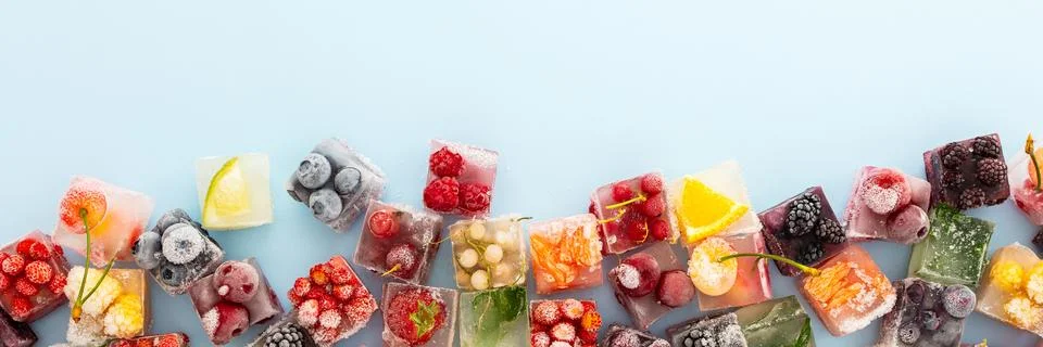 Blue background with ice berries cubes Stock Photos