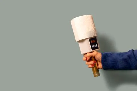 On a blue background, a journalist's microphone, instead of a sound filter, i Stock Photos