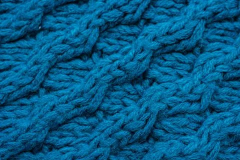Blue background with large knitted thread pattern Foto stock