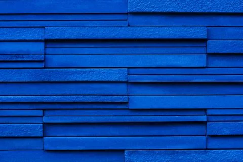 Blue background, long bricks in raw Stock Photos